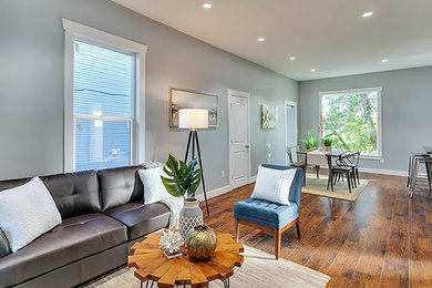 Inspiration for a small craftsman formal and enclosed medium tone wood floor and brown floor living room remodel in Portland with gray walls, no fireplace and no tv