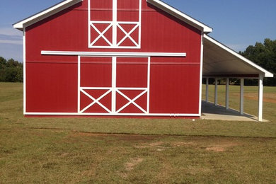 Example of a cottage red exterior home design in Other