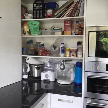 Compact kitchen with Steel Grey Granite benches and gloss white cabinetry