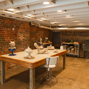 This is an example of a large world-inspired walk-out basement in Other with concrete flooring and brown floors.