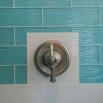 Luxurious White and Teal Glass Master Bathroom