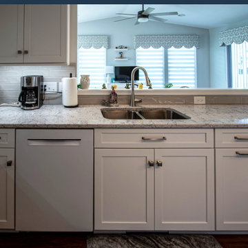 White Shaker Kitchen w/ Pietra Quartz Countertops & Gray Subway Tile Backsplash