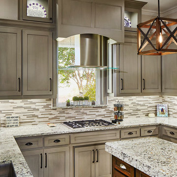 Kitchen downdraft cooktop is redesigned with an island hood.
