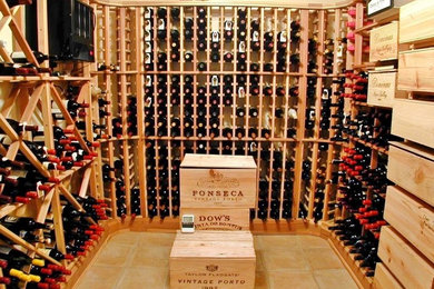 Large elegant terra-cotta tile wine cellar photo in New York