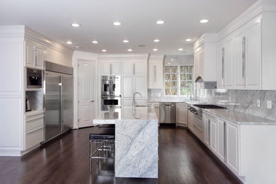 Inspiration for a large transitional l-shaped medium tone wood floor eat-in kitchen remodel in Baltimore with an undermount sink, recessed-panel cabinets, white cabinets, quartz countertops, gray backsplash, quartz backsplash, stainless steel appliances, an island and gray countertops