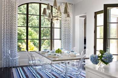 Inspiration for a timeless dark wood floor enclosed dining room remodel in Atlanta with gray walls