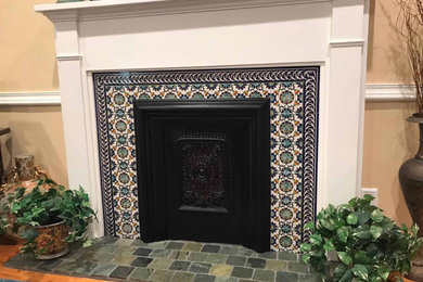 Inspiration for a 1950s family room remodel in Los Angeles with a standard fireplace and a tile fireplace