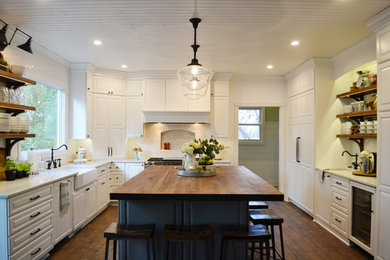 Inspiration for a large contemporary u-shaped dark wood floor and brown floor eat-in kitchen remodel in Denver with a farmhouse sink, white cabinets, wood countertops, white backsplash, ceramic backsplash, white appliances, an island and red countertops