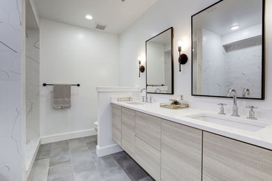 Alcove shower - mid-sized contemporary master gray tile and porcelain tile ceramic tile and gray floor alcove shower idea in DC Metro with flat-panel cabinets, light wood cabinets, white walls, an undermount sink and quartz countertops