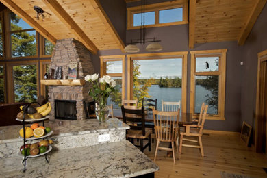 Large mountain style galley dark wood floor open concept kitchen photo in Boston with an undermount sink, shaker cabinets, white cabinets, granite countertops, stainless steel appliances and an island