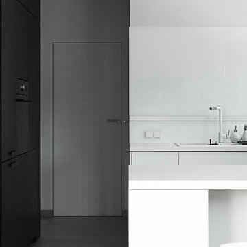 Black&white kitchen in a loft style house interior in Rokietnica