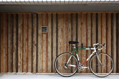 Inspiration for a modern house exterior in Kobe with wood siding.