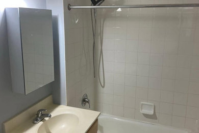Mid-sized minimalist 3/4 bathroom photo in Seattle with a built-in vanity