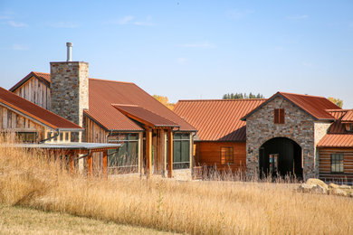 Example of a mountain style home design design in Calgary