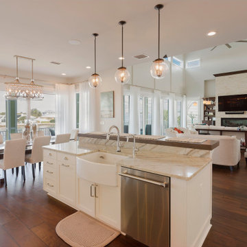 Open-Concept Coastal Kitchen and Living Room with Elegant Finishes and Waterfron