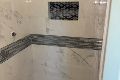 Example of a mid-sized minimalist master multicolored tile and ceramic tile bathroom design in New Orleans