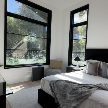 Primary Bedroom with Floor-to-Ceiling Black-Framed Windows - Studio City