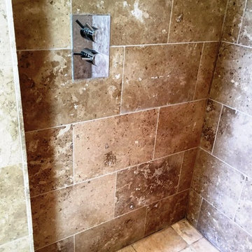 Damaged Limestone tiled en-Suite in West Hanney