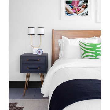 A guest room was kept clean and minimal to create a boutique hotel feel. Utilize