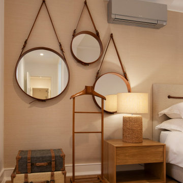 Primary Bedroom Round Mirrors in Picoas Apartment