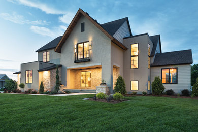 Large transitional beige two-story concrete fiberboard exterior home idea in Minneapolis with a shingle roof