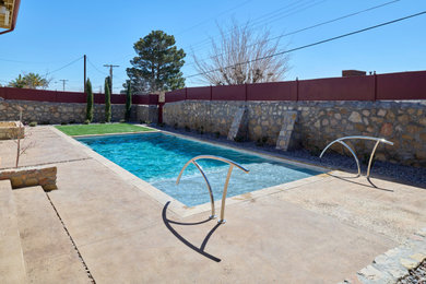 Pool - mid-sized traditional backyard rectangular pool idea in Other