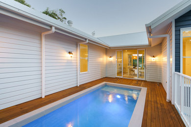 Inspiration for a mid-sized traditional rooftop rectangular aboveground pool in Sunshine Coast.