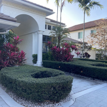 Elegant Front Yard Transformation: Modern Hardscape & Lush Greenery