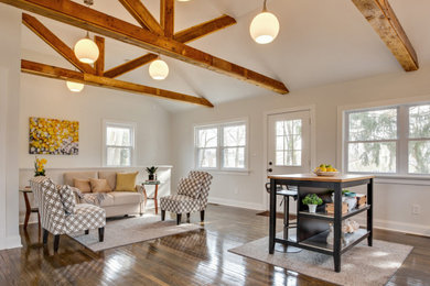 Inspiration for a small transitional enclosed dark wood floor, brown floor and exposed beam living room remodel in Wilmington with white walls