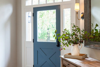 Entryway - large coastal light wood floor entryway idea in Minneapolis with gray walls and a blue front door