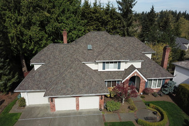Design ideas for a large traditional two-storey white house exterior in Seattle with a hip roof and a shingle roof.