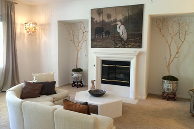 Example of a trendy carpeted living room design in Other with white walls and no tv