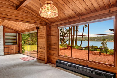 Sunroom - rustic sunroom idea in Seattle with a standard ceiling