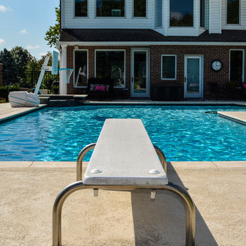 Grecian swimming pool with L, diving board and hot tub