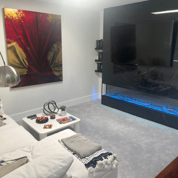 Sunken Media Room with Custom Fireplace Feature Wall – Integrated Interior Desig