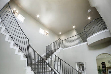 Inspiration for a large transitional foyer in Austin with grey walls and porcelain floors.