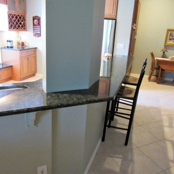 Galaxy Pecan cabinets with peacock green granite