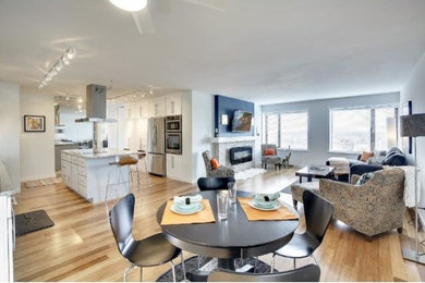 Inspiration for a large transitional great room remodel in Minneapolis with blue walls, a standard fireplace and a stone fireplace