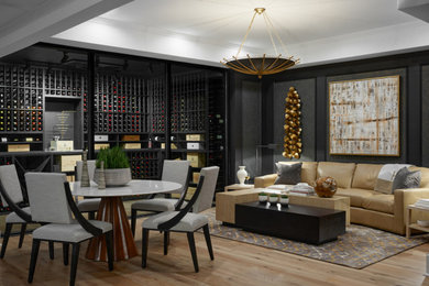 Design ideas for a large traditional wine cellar in Atlanta with light hardwood flooring.