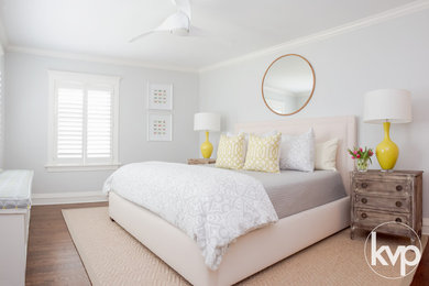 Example of a large minimalist master dark wood floor bedroom design in Chicago with gray walls