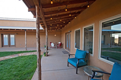 Mid-sized southwest front porch photo in Austin