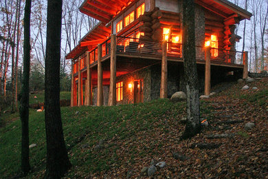 Mid-sized mountain style brown two-story mixed siding exterior home photo in Milwaukee