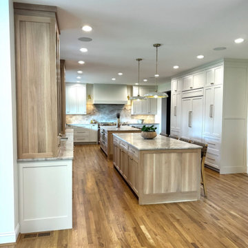 Frameless white perimeter with rift cut oak islands