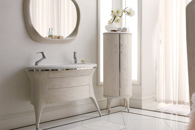 Trendy master white tile bathroom photo in Toronto with a drop-in sink, flat-panel cabinets, light wood cabinets, marble countertops and white walls