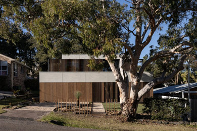 Design ideas for a mid-sized contemporary two-storey house exterior in Central Coast.
