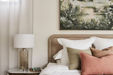 This is an example of a large transitional master bedroom in Melbourne with white walls, dark hardwood floors, no fireplace, brown floor and vaulted.