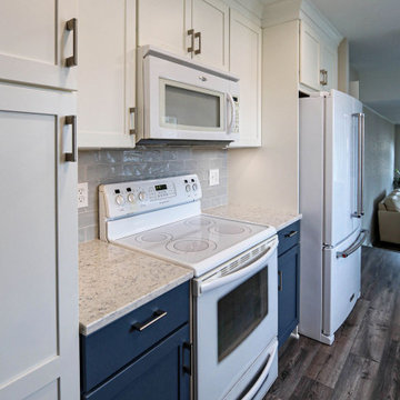 Two-Tone White & Blue Kitchen with Smoke Stained Quartz Countertops