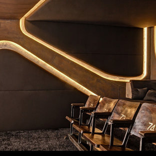 Mid-sized trendy enclosed carpeted home theater photo in Berlin