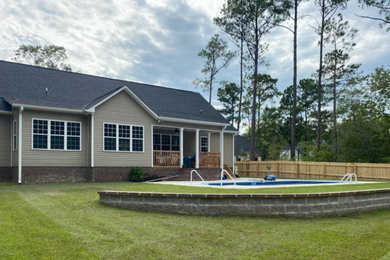 Large traditional exterior home idea in Other
