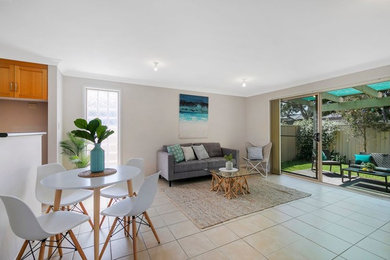 This is an example of a beach style living room in Central Coast.
